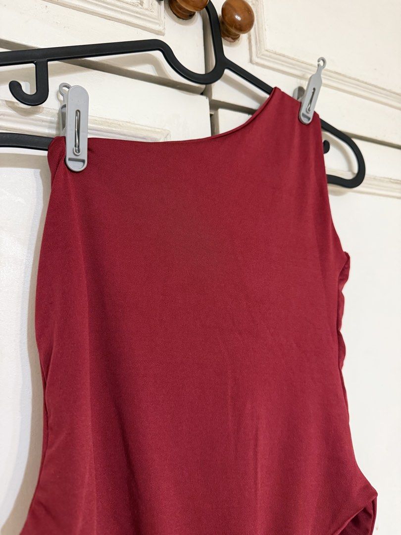 Maroon One-Shoulder Bodysuit (Category: Sleeveless) located in Rizal. Submitted by rianaht (Listing ID 1469932408, Image 2). Description: - Color: Deep maroon - Style: Asymmetric one-shoulder, high-cut leg - Fabric: Smooth and stretchy - Versatility: Easy to pair with jeans or skirts for a night out - Condition: Never been used 🌸 RFS: Decluttering 🌸 Delivery only to be shouldered by the buyer. 🌸 Payment via GCash / Maya / Maribank.