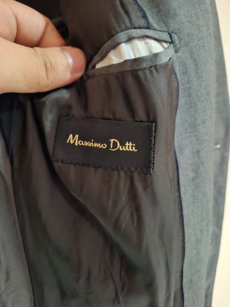 Massimo Dutti Grey Suit Jacket Size 48 (Category: Coats, Jackets and Outerwear) located in Quezon City. Submitted by phillip31 (Listing ID 1469786492, Image 3). Description: - Brand: Massimo Dutti (Inditex) - Color: Grey - Size: 48 (European sizing) - Material: Fine Italian fabric - Fit: Tailored with structured shoulders and notched lapels - Details: Four-button cuffs, double-button front closure, fully lined with striped sleeve accents - Style:
