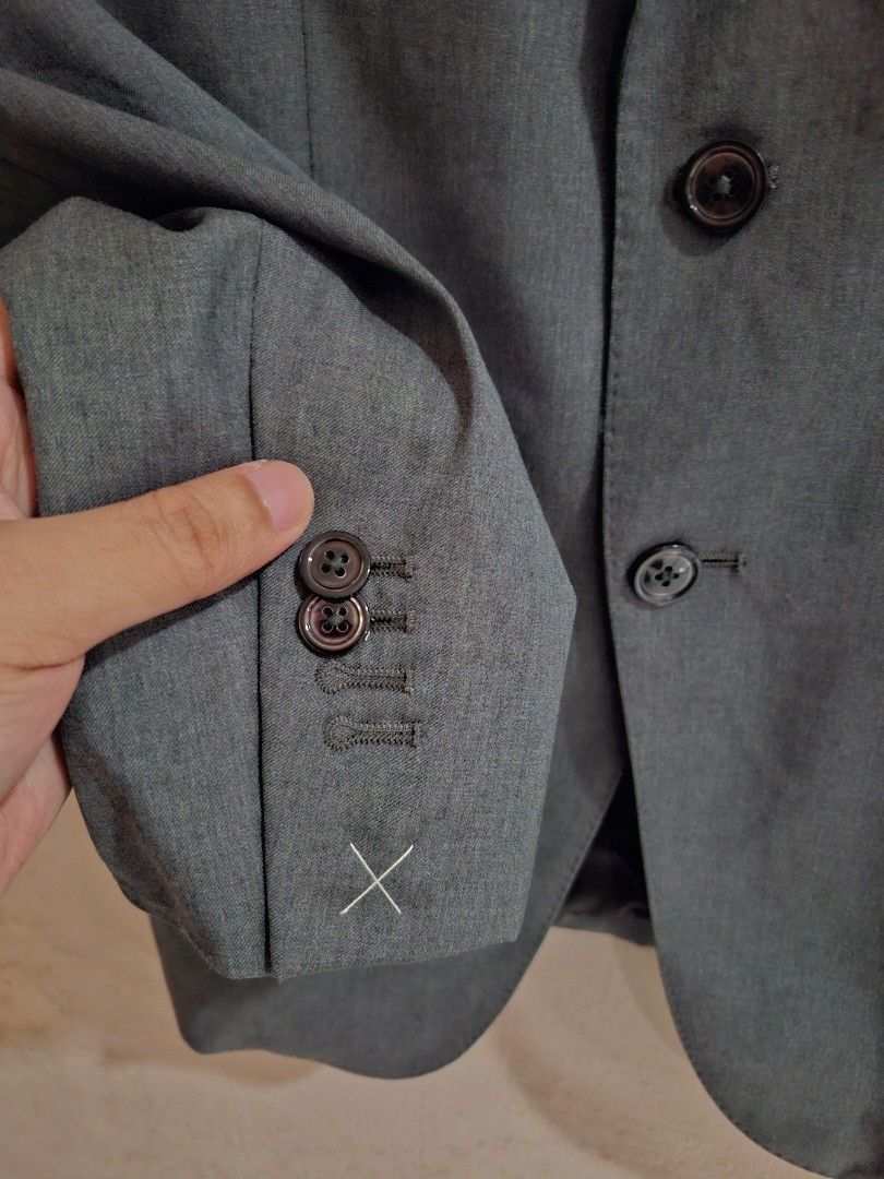 Massimo Dutti Grey Suit Jacket Size 48 (Category: Coats, Jackets and Outerwear) located in Quezon City. Submitted by phillip31 (Listing ID 1469786492, Image 2). Description: - Brand: Massimo Dutti (Inditex) - Color: Grey - Size: 48 (European sizing) - Material: Fine Italian fabric - Fit: Tailored with structured shoulders and notched lapels - Details: Four-button cuffs, double-button front closure, fully lined with striped sleeve accents - Style: