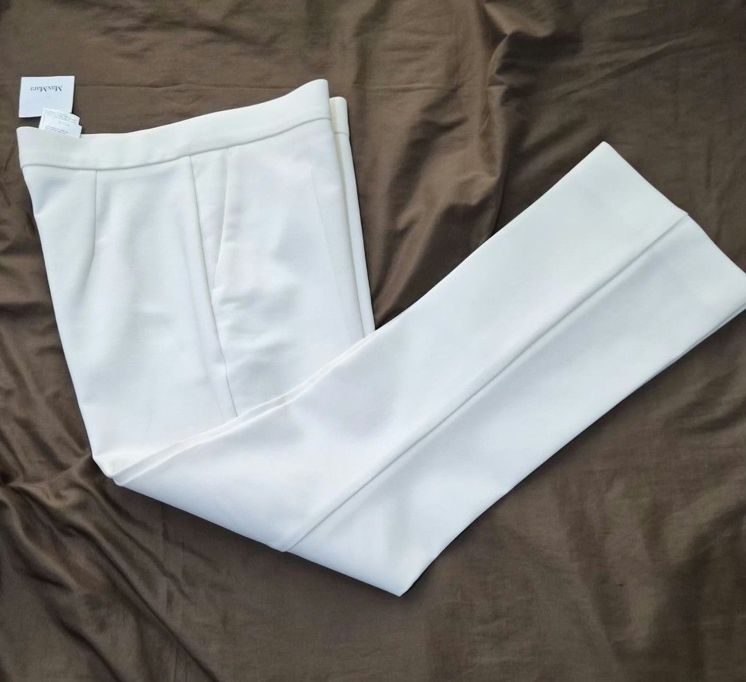 MaxMara White Trousers (Category: Jeans) located in Paranaque City. Submitted by calm_youngstore7 (Listing ID 1469878797, Image 2). Description: PRICE CUT! LAST PIECE SALE! - Brand: MaxMara - Color: White - Origin: Made in Italy - Condition: Brand new with original retail tags attached - Design: Clean tailoring with sharp front crease lines and functional side pockets - Style: Versatile piece, perfect for smart casual or formal wear **JUST IN CAS