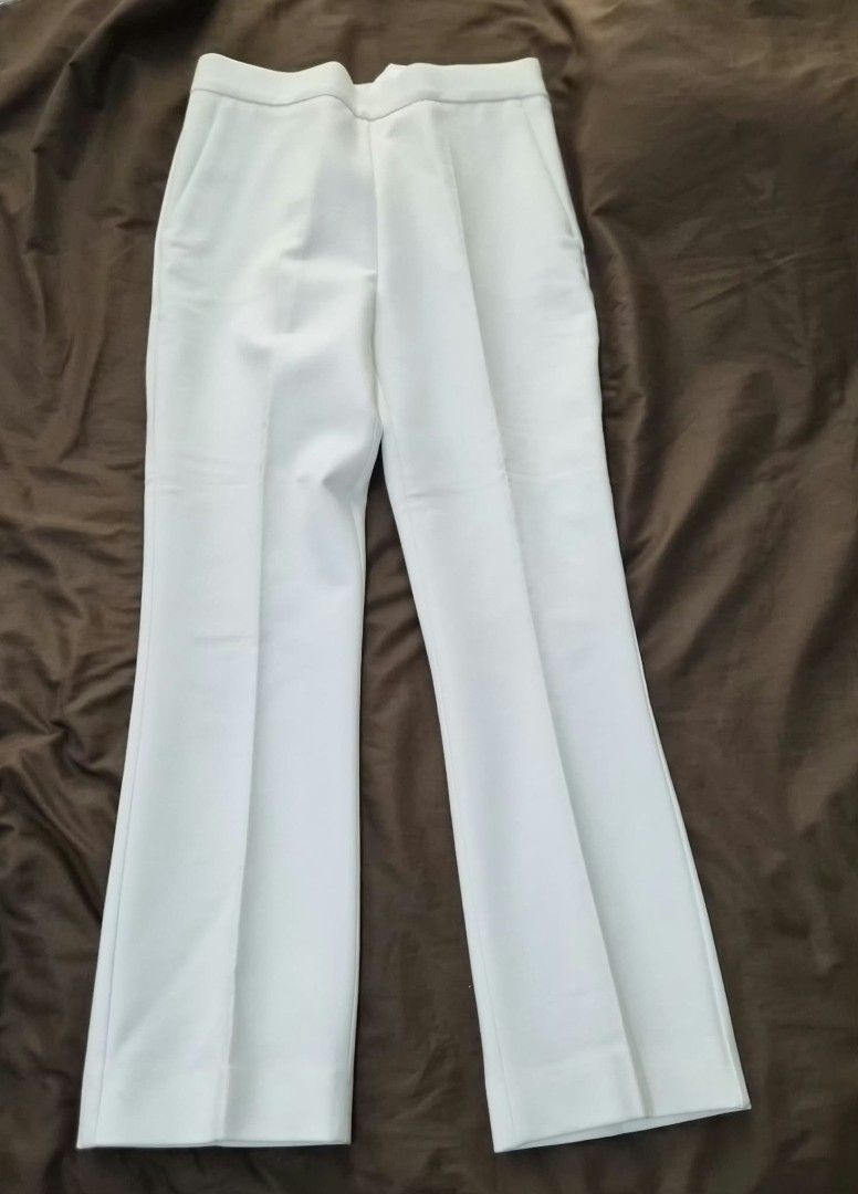 MaxMara White Trousers (Category: Jeans) located in Paranaque City. Submitted by calm_youngstore7 (Listing ID 1469878797, Image 1). Description: PRICE CUT! LAST PIECE SALE! - Brand: MaxMara - Color: White - Origin: Made in Italy - Condition: Brand new with original retail tags attached - Design: Clean tailoring with sharp front crease lines and functional side pockets - Style: Versatile piece, perfect for smart casual or formal wear **JUST IN CAS