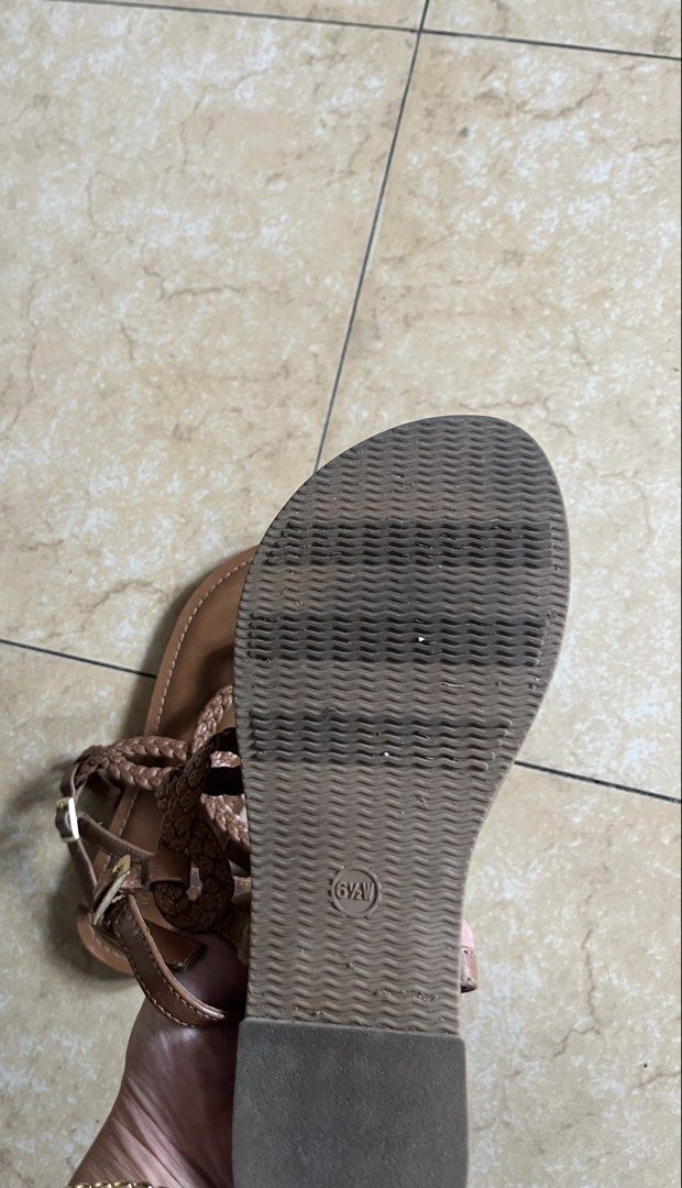 Merona Brown Braided Thong Sandals (Category: Flats & Sandals) located in Quezon City. Submitted by iamina16 (Listing ID 1469774432, Image 2). Description: - Brand: Merona - Size: 6.5W - Color: Brown - Style: Flat T-strap sandals with braided straps and side buckle closure - Condition: Soles show minor wear from walking, overall very comfortable for warm weather.