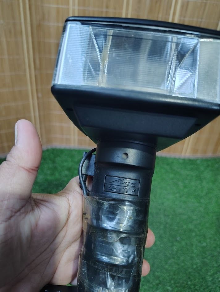 METZ MECABLITZ 45 CT-1 HANDLE-MOUNT ELECTRONIC FLASH (Category: Cameras) located in Dasmarinas. Submitted by k3japanstoreph (Listing ID 1469921395, Image 2). Description: METZ MECABLITZ 45 CT-1 HANDLE-MOUNT ELECTRONIC FLASH Vintage Metz Mecablitz 45 CT-1 electronic camera flash with the classic handle-mount “hammerhead” design. A collectible photography accessory for vintage camera enthusiasts and collectors. CONDITION: AS IS, UNTESTED • Function