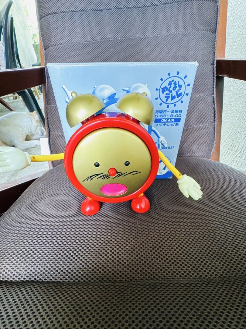 Mezamashi TV Alarm Clock Fujitv Character (Category: Clocks) located in Santa Cruz. Submitted by maqui15 (Listing ID 1469794501, Image 2). Description: - Authentic Japanese import Fuji TV Mezamashi TV talking alarm clock - Eye-catching red and gold design with movable arms and removable faceplate - Tested and 100% working condition - Battery-operated for easy placement on any desk or bedside table - Comes with original box (minor storage wear on 