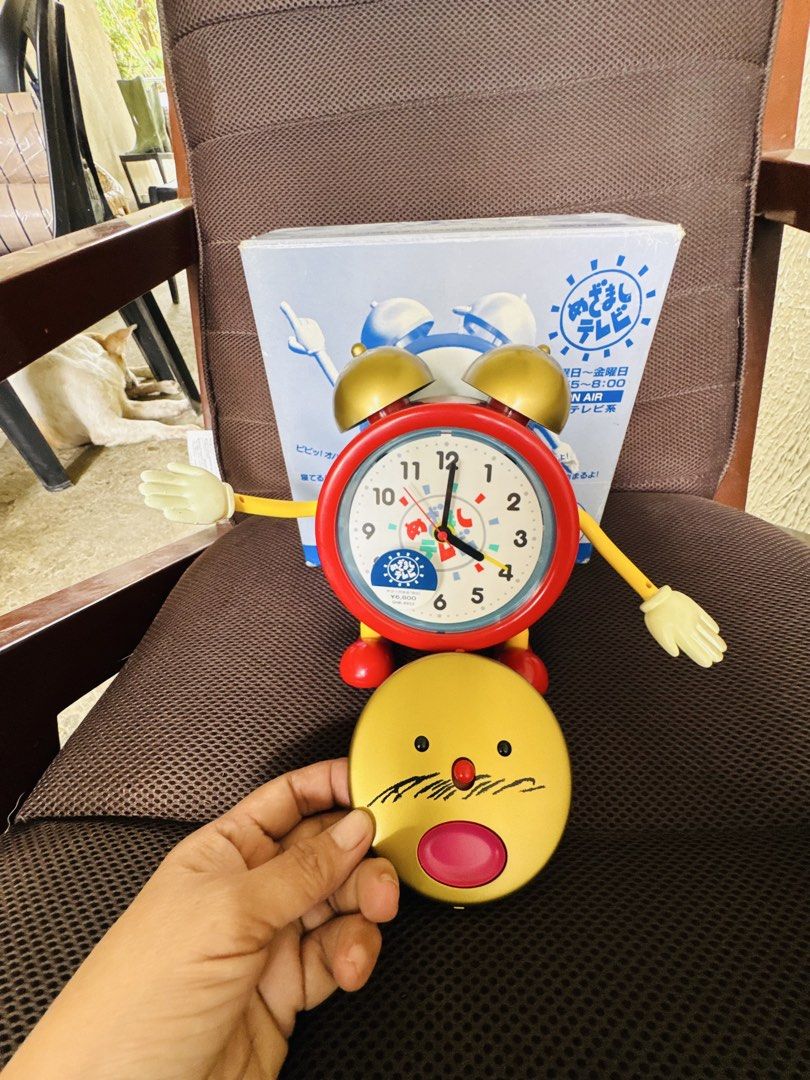Mezamashi TV Alarm Clock Fujitv Character (Category: Clocks) located in Santa Cruz. Submitted by maqui15 (Listing ID 1469794501, Image 3). Description: - Authentic Japanese import Fuji TV Mezamashi TV talking alarm clock - Eye-catching red and gold design with movable arms and removable faceplate - Tested and 100% working condition - Battery-operated for easy placement on any desk or bedside table - Comes with original box (minor storage wear on 