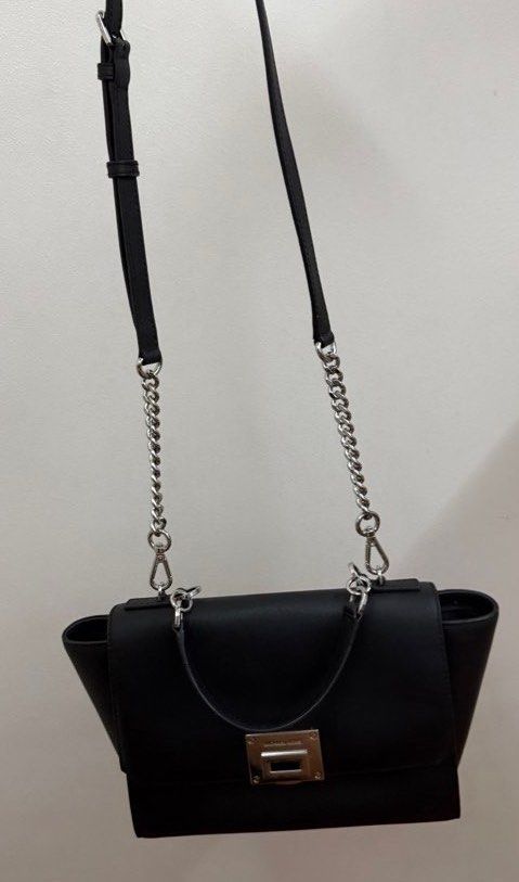 Michael Kors Black Satchel Handbag With Silver Hardware (Category: Luxury Bags & Wallets) located in Quezon City. Submitted by _daynes (Listing ID 1469852419, Image 2). Description: Visible signs of usage.