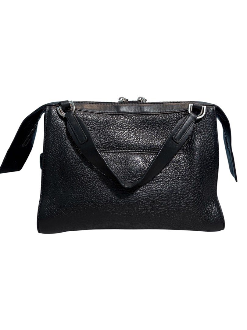 Michael Kors Ingrid Medium Leather Shoulder Bag (Category: Shoulder Bags) located in Cagayan de Oro. Submitted by thatsdopethrift (Listing ID 1469898743, Image 2). Description: Clean, spacious everyday bag that can be carried comfortably as a top handle or over-the-shoulder bag. Flaws: Missing the long adjustable crossbody strap. Selling as a top handle / short shoulder bag style only..