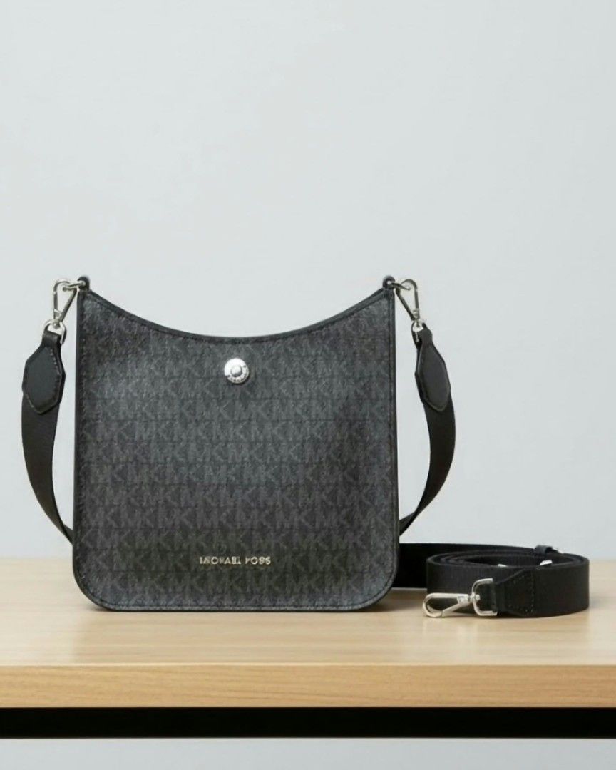 Michael Kors Signature Logo Shoulder Bag (Category: Shoulder Bags) located in Manila. Submitted by aituy (Listing ID 1443202074, Image 1). Description: • Brandnew and Authentic • US bought MK Briley Small Logo Messenger Bag • Silver Hardware • Plain Black Guitar Strap • Messenger bag • Model number 35S1S7BM1B • Logo-print canvas (Black Monogram) • 69% coated canvas/17% polyester/13% cotton/1% polyurethane • 7.75”W X 7.75”H X 2.5”D • Exterior deta