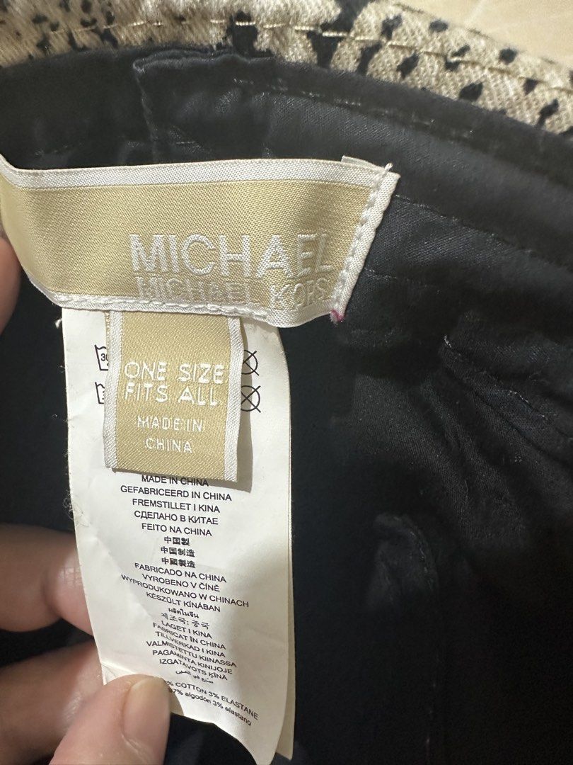 Michael Kors Snake Print Bucket Hat (Category: Hats & Beanies) located in Balanga. Submitted by jamilbeauty5 (Listing ID 1469890090, Image 3). Description: - Brand: Michael Kors - Design: Snake print pattern in black and beige - Details: Signature metal logo plaque on the front - Interior: Black inner lining with size and material tag - Size: One size fits all - Style: Great for sunny days or casual streetwear - Guaranteed authentic! .