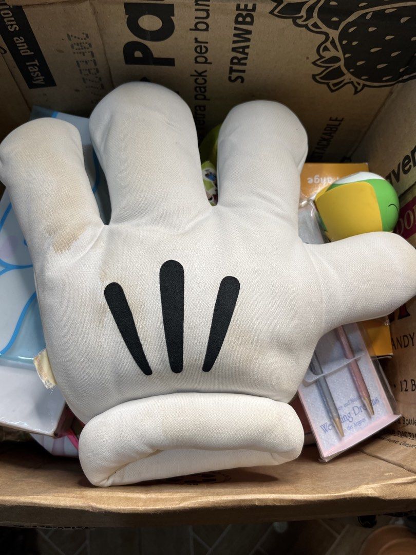 Mickey Mouse White Glove Hand Pillow Plush (Category: Plushies & Soft Toys) located in Gapan. Submitted by lunashop14 (Listing ID 1469836588, Image 1). Description: - Iconic Mickey Mouse white glove plush toy with classic three black stripes - Features original Mickey Mouse tag attached on the side - Standard cushion size made with soft, huggable material - Note: Has noticeable yellowing and stains due to long-term storage - Perfect for Disney co