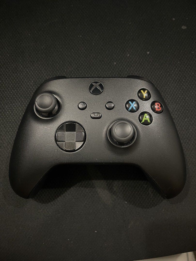 Microsoft Xbox Wireless Controller Carbon Black (Category: Controllers) located in Cainta. Submitted by vanseal (Listing ID 1469886128, Image 1). Description: - Color: Carbon Black - Layout: Standard with ABXY buttons, dual analog sticks, and D-pad - Grip: Textured rear handles for better hold - Connectivity: USB-C port for wired play and Bluetooth connection for pc - Condition: Clean, buttons click normally, sticks move smoothly with no noticeab