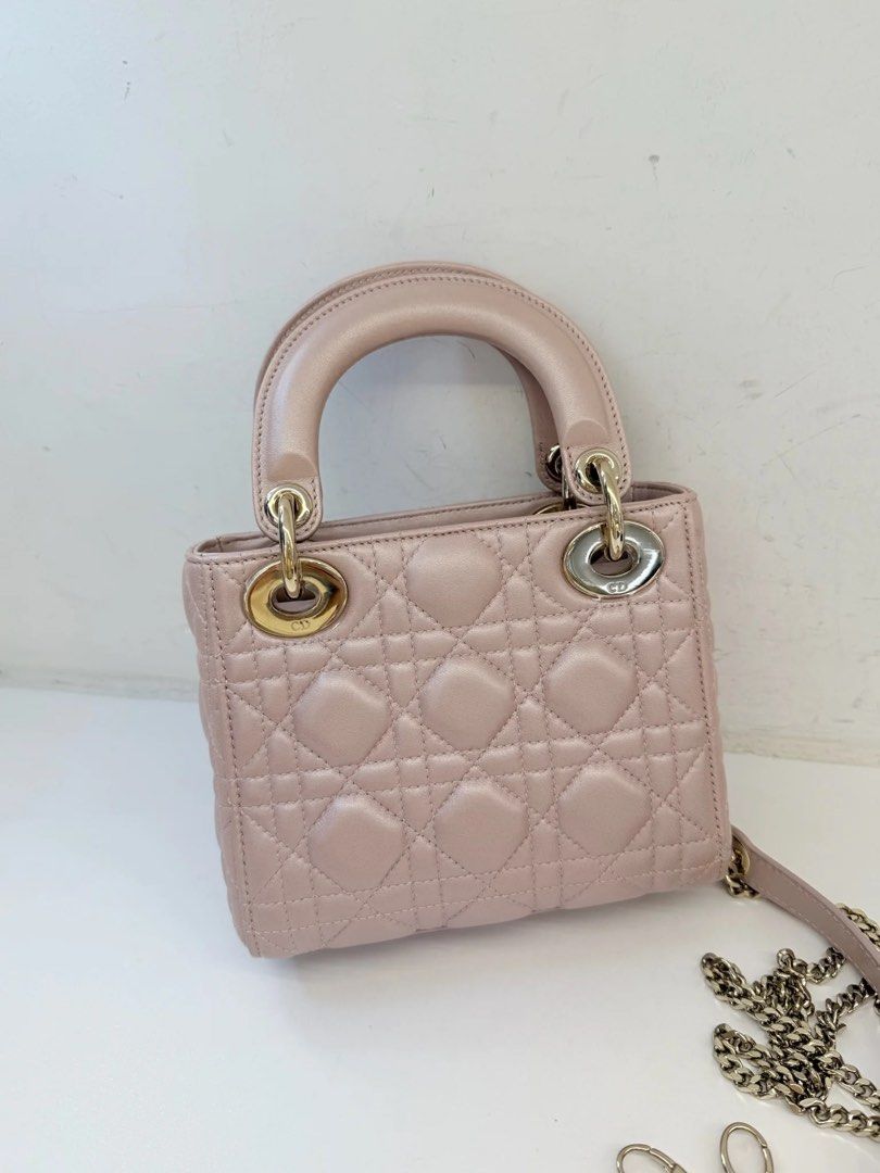 MINI LADY DIOR PEARL PINK (Category: Luxury Bags & Wallets) located in Makati City. Submitted by theladyluxe.ph (Listing ID 1469761203, Image 2). Description: 𝐎𝐍 𝐇𝐀𝐍𝐃 ✨ MINI LADY DIOR✨ Pearl/ Iridescent Pink color Excellent Condition Comes with chain strap, dust bag & certificate of authenticity Store Price 360k+ 🏷️ 175k Only up to 3 months layaway Nego for cash 💳 MOP: BPI/Bank Transfer/Gcash/Maya/Paypal DISCLAIMER: theladyluxxe is NOT AF