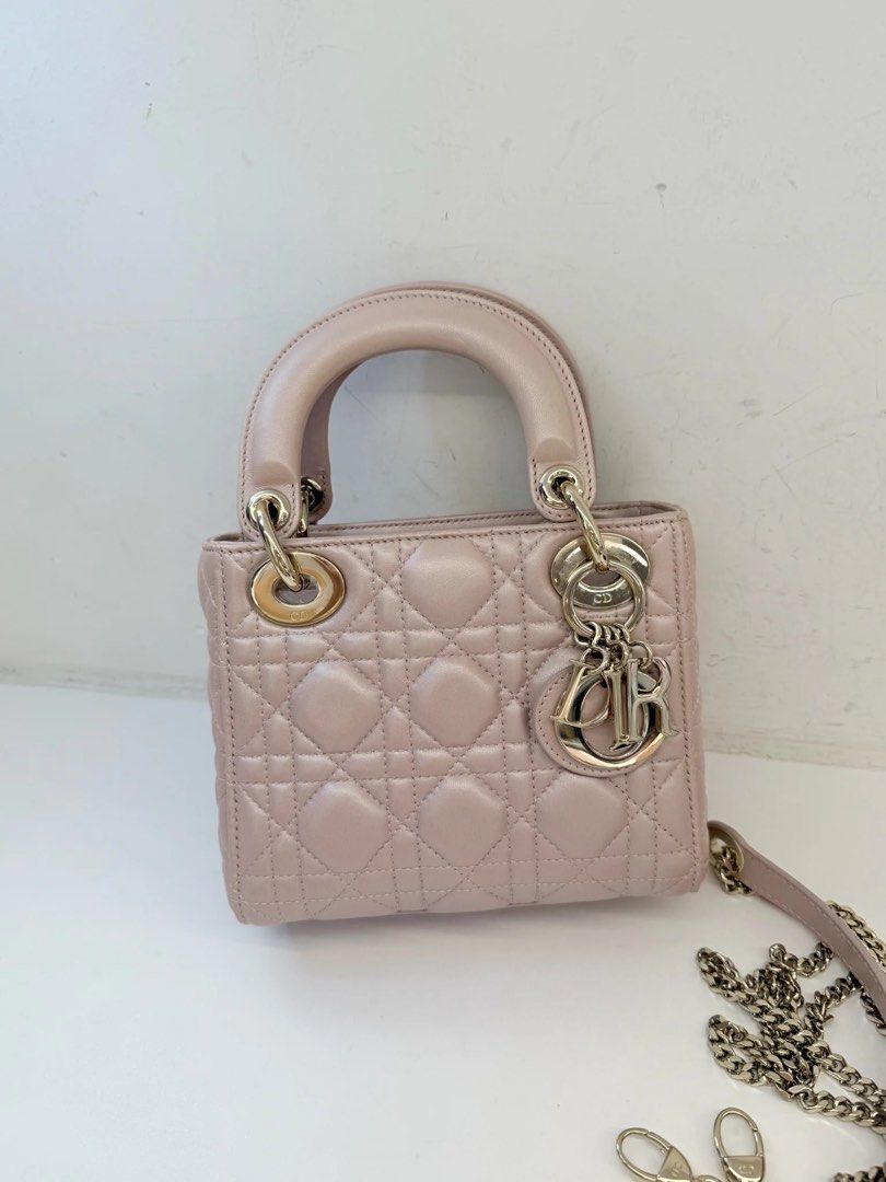 MINI LADY DIOR PEARL PINK (Category: Luxury Bags & Wallets) located in Makati City. Submitted by theladyluxe.ph (Listing ID 1469761203, Image 1). Description: 𝐎𝐍 𝐇𝐀𝐍𝐃 ✨ MINI LADY DIOR✨ Pearl/ Iridescent Pink color Excellent Condition Comes with chain strap, dust bag & certificate of authenticity Store Price 360k+ 🏷️ 175k Only up to 3 months layaway Nego for cash 💳 MOP: BPI/Bank Transfer/Gcash/Maya/Paypal DISCLAIMER: theladyluxxe is NOT AF