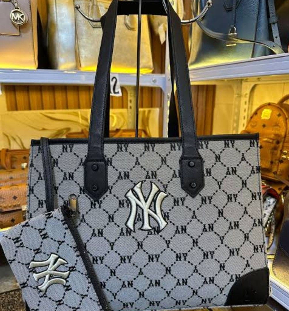 MLB Monogram NY Yankees Tote Bag with Pouch (Category: Tote Bags) located in Manila. Submitted by lene48 (Listing ID 1469759520, Image 1). Description: - MLB NY Yankees tote bag in a chic grey and black monogram pattern - Includes a matching small zippered pouch for your coins or cards - Features a bold white NY Yankees logo on the front - Equipped with sturdy double top handles and structured base corners - Spacious interior to easily fit your d
