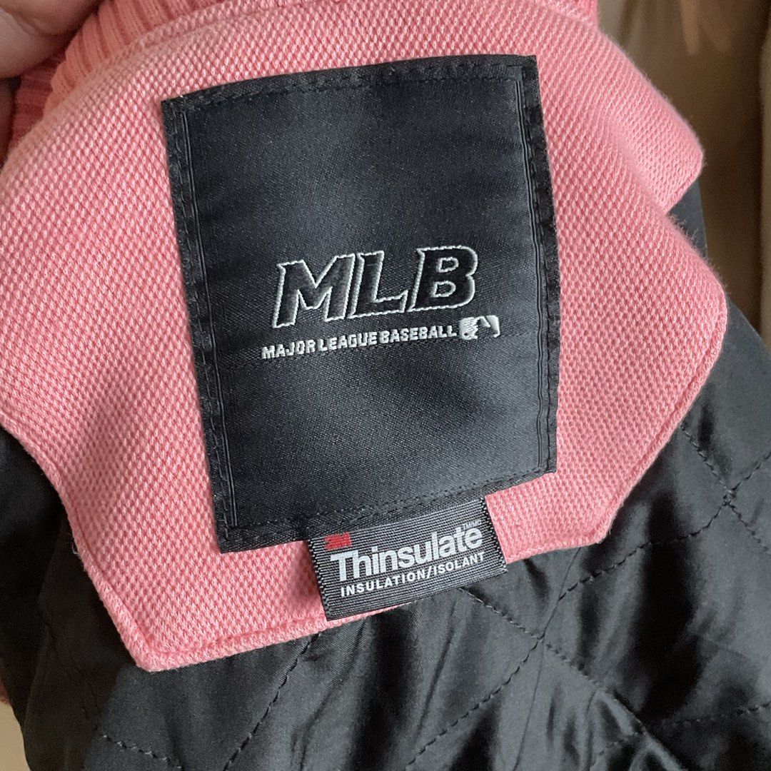 MLB New York Yankees Pink Varsity Jacket (Category: Coats, Jackets and Outerwear) located in La Trinidad. Submitted by di_tiyak (Listing ID 1469778367, Image 3). Description: - Authentic MLB New York Yankees merchandise - Eye-catching pink color with snap-button closure - Features Yankees chest logo patch and bold sleeve lettering - Striped rib-knit collar, cuffs, and hem - Quilted black interior lining with warm 3M Thinsulate insulation - Ships 