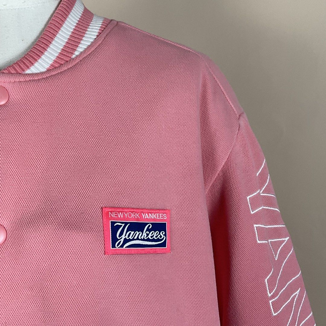 MLB New York Yankees Pink Varsity Jacket (Category: Coats, Jackets and Outerwear) located in La Trinidad. Submitted by di_tiyak (Listing ID 1469778367, Image 2). Description: - Authentic MLB New York Yankees merchandise - Eye-catching pink color with snap-button closure - Features Yankees chest logo patch and bold sleeve lettering - Striped rib-knit collar, cuffs, and hem - Quilted black interior lining with warm 3M Thinsulate insulation - Ships 