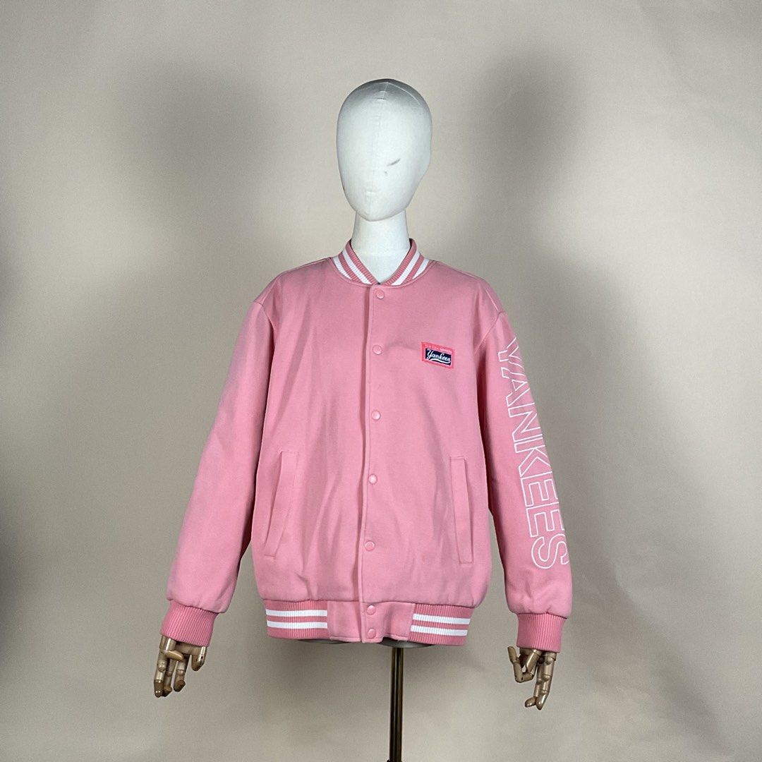 MLB New York Yankees Pink Varsity Jacket (Category: Coats, Jackets and Outerwear) located in La Trinidad. Submitted by di_tiyak (Listing ID 1469778367, Image 1). Description: - Authentic MLB New York Yankees merchandise - Eye-catching pink color with snap-button closure - Features Yankees chest logo patch and bold sleeve lettering - Striped rib-knit collar, cuffs, and hem - Quilted black interior lining with warm 3M Thinsulate insulation - Ships 