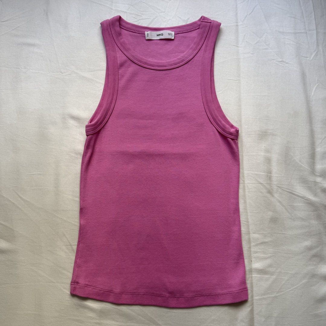 MNG Pink Ribbed Tank Top Size S (Category: Sleeveless) located in Pasig City. Submitted by notshynotmeee (Listing ID 1469808770, Image 1). Description: - Brand: MNG - Size: S (tag on collar) - Color: Bright pink - Material: Soft and stretchy cotton - Design: Scoop neckline with ribbed trim - Style: Versatile basic piece, great for warm weather and easily paired with denim, skirts, or shorts.