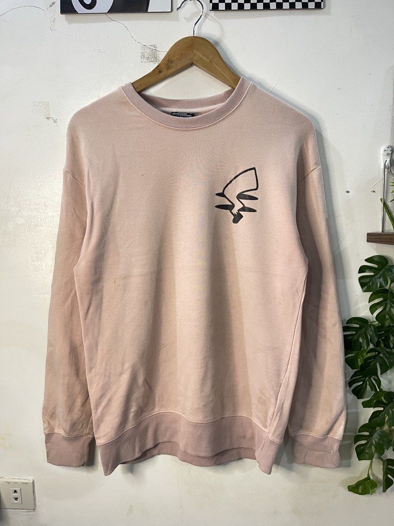 MOREBRAVE Pink Pikachu Graphic Sweatshirt Size M (Category: Coats, Jackets and Outerwear) located in Cabagan. Submitted by blessingma81004 (Listing ID 1469770659, Image 2). Description: - Brand: MOREBRAVE - Design: Pikachu graphic on front and back with "Love you" text on the back - Color: Pink - Size: Tagged M (fits like a Large) - Measurements: Width 19.5 inches, Length 27.5 inches - Material: 100% cotton (Made in China) - Condition: Shows some