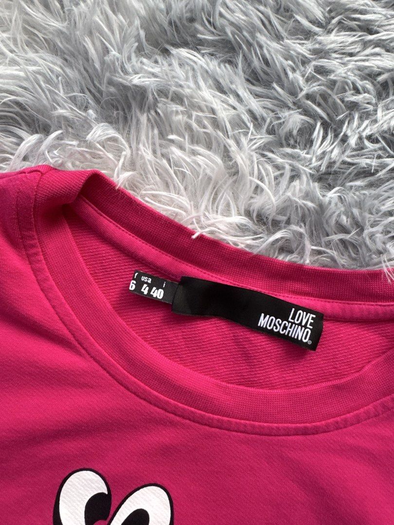Moschino cropped tee (Category: Blouses) located in Taguig. Submitted by mrwickjohn67 (Listing ID 1469910905, Image 3). Description: Moschino Cropped tee for Women As new Issue: none Size: in inches (WXL) 19.5x19.5.
