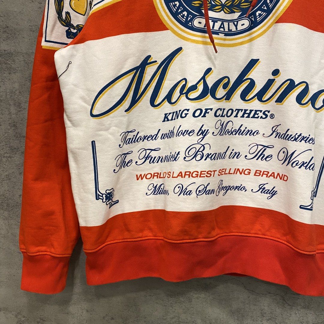 Moschino Hoodie Jacket (Category: Luxury Apparel) located in Quezon City. Submitted by rebirthalley (Listing ID 1469840227, Image 3). Description: Width-21 Length-24.5 Sleeve-23 Shoulder-19 Hem-18 Brandnew with hangtag No flaws.