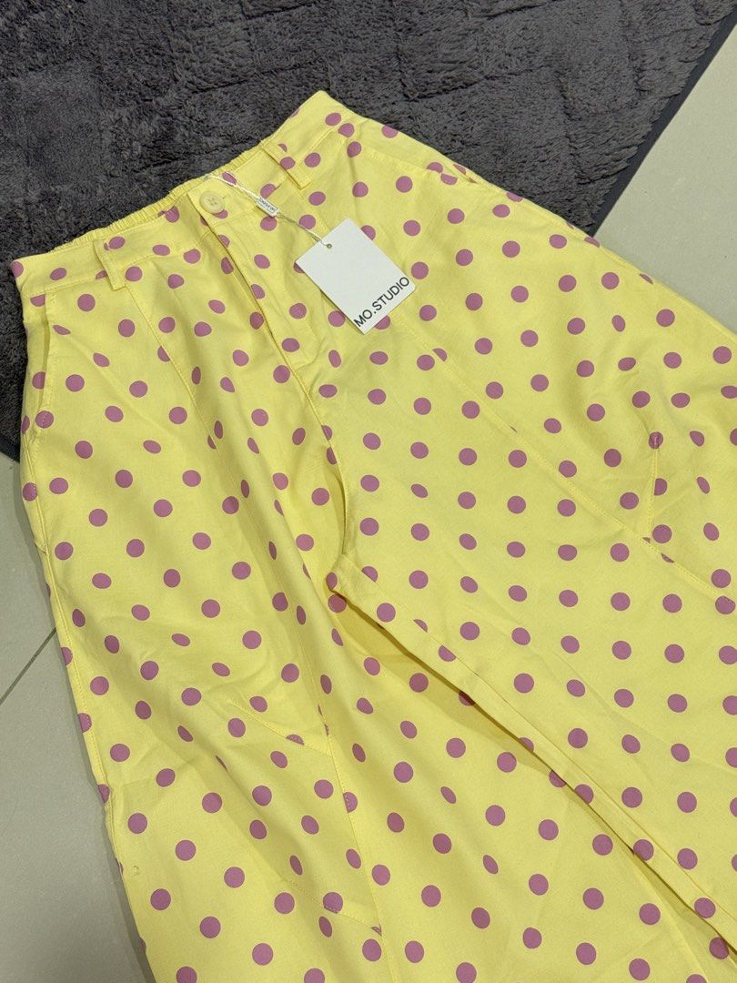 mo.studio Yellow Polka Dot Barrel Pants (Category: Skirts) located in Pasig City. Submitted by revolveisland (Listing ID 1469899572, Image 3). Description: - Brand: New with tags attached - Color/Pattern: Bright yellow with purple polka dots - Fit: High-waisted barrel fit - Details: Front pockets and secure button closure - Styling: Perfect to pair with simple crop tops or blouses.