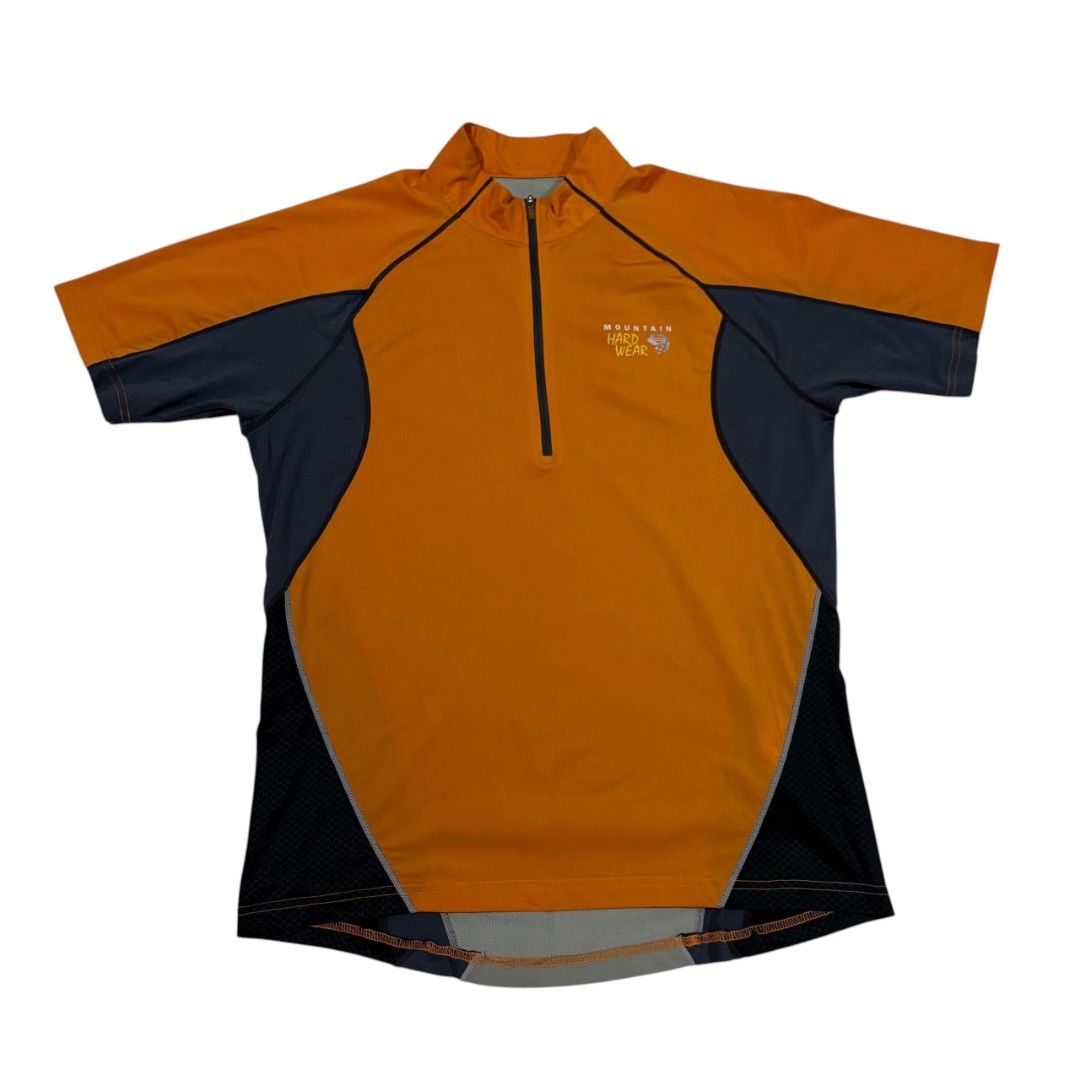 Mountain Hardwear Short Sleeve (Category: Activewear) located in Cagayan de Oro. Submitted by lootfindzzzz (Listing ID 1469915830, Image 1). Description: - Brand: Mountain Hardwear - Style: Athletic cycling jersey with half-zip front and mock neck - Colors: Vibrant orange, dark gray, and light green colorblock design - Breathability: Mesh side panels for enhanced airflow during intense workouts - Safety: High-visibility details and reflective tab