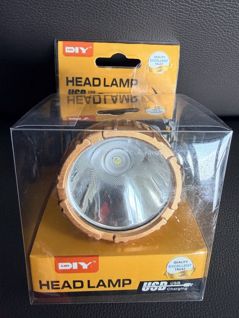 MR. DIY USB Charging Head Lamp (Category: Lighting) located in Quezon City. Submitted by edenkhan (Listing ID 1469918920, Image 3). Description: - Brand: MR. DIY LED Head Lamp - Color: Stylish Gold and Black - Material: Durable, wear-resistant ABS plastic - Lighting: High brightness LED beads - Battery: Built-in 18650 lithium battery (USB rechargeable) - Condition: Brand new, still inside original plastic packaging - Ideal for: Outdoor work, camp