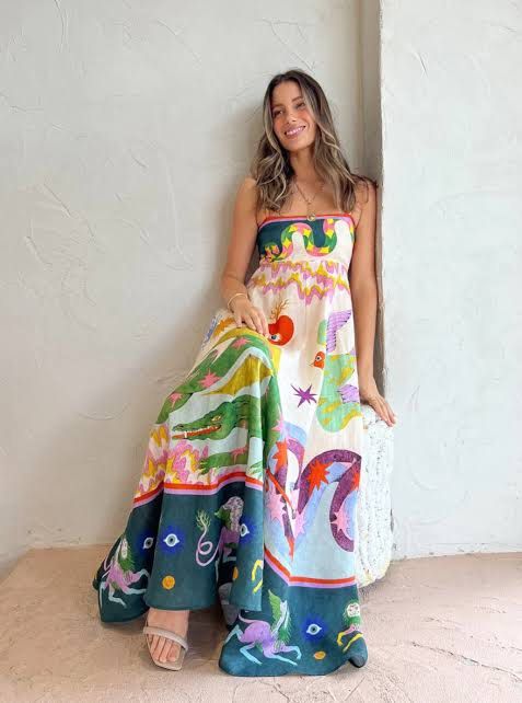 Multicolor printed linen maxi dress (Category: Dresses) located in Manila. Submitted by preloved_finds_dc (Listing ID 1469923321, Image 2). Description: - Style: Long linen maxi dress with colorful vintage artwork - Design: Square neckline, thin spaghetti straps, and fitted bodice - Fit: Relaxed full skirt with a dark green contrast border at the bottom - Fabric: Lightweight and breezy for warm weather - Occasion: Ideal for beach days, summer par