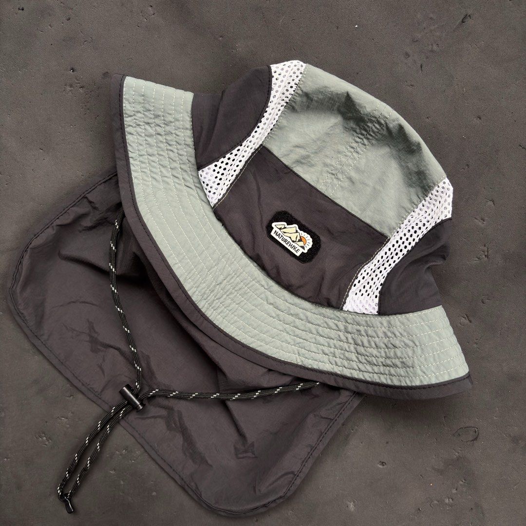 Nature Hike Sun Screen Mesh Bucket Hat (Category: Caps & Hats) located in Manila. Submitted by loydgani (Listing ID 1469856129, Image 2). Description: Key Features: • Condition: Good as new (9.5/10). No tears, stains, or signs of wear. Inner wash tag is completely crisp and clean. • Sun Protection: Features a wide 360° brim plus a long detachable snap-on neck flap at the back for maximum UV protection. • Breathable Design: Side mesh panels allow 