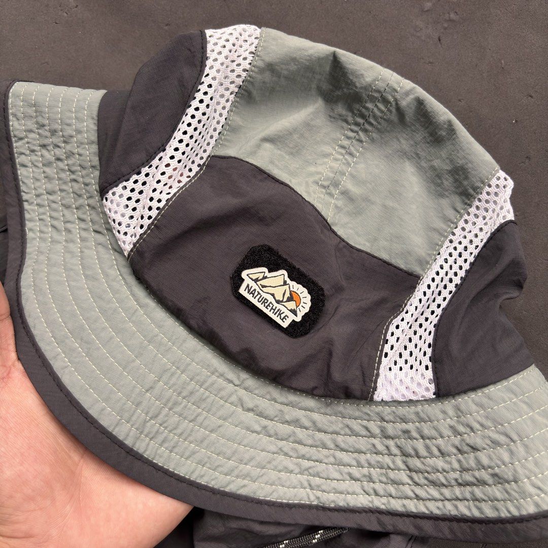 Nature Hike Sun Screen Mesh Bucket Hat (Category: Caps & Hats) located in Manila. Submitted by loydgani (Listing ID 1469856129, Image 3). Description: Key Features: • Condition: Good as new (9.5/10). No tears, stains, or signs of wear. Inner wash tag is completely crisp and clean. • Sun Protection: Features a wide 360° brim plus a long detachable snap-on neck flap at the back for maximum UV protection. • Breathable Design: Side mesh panels allow 