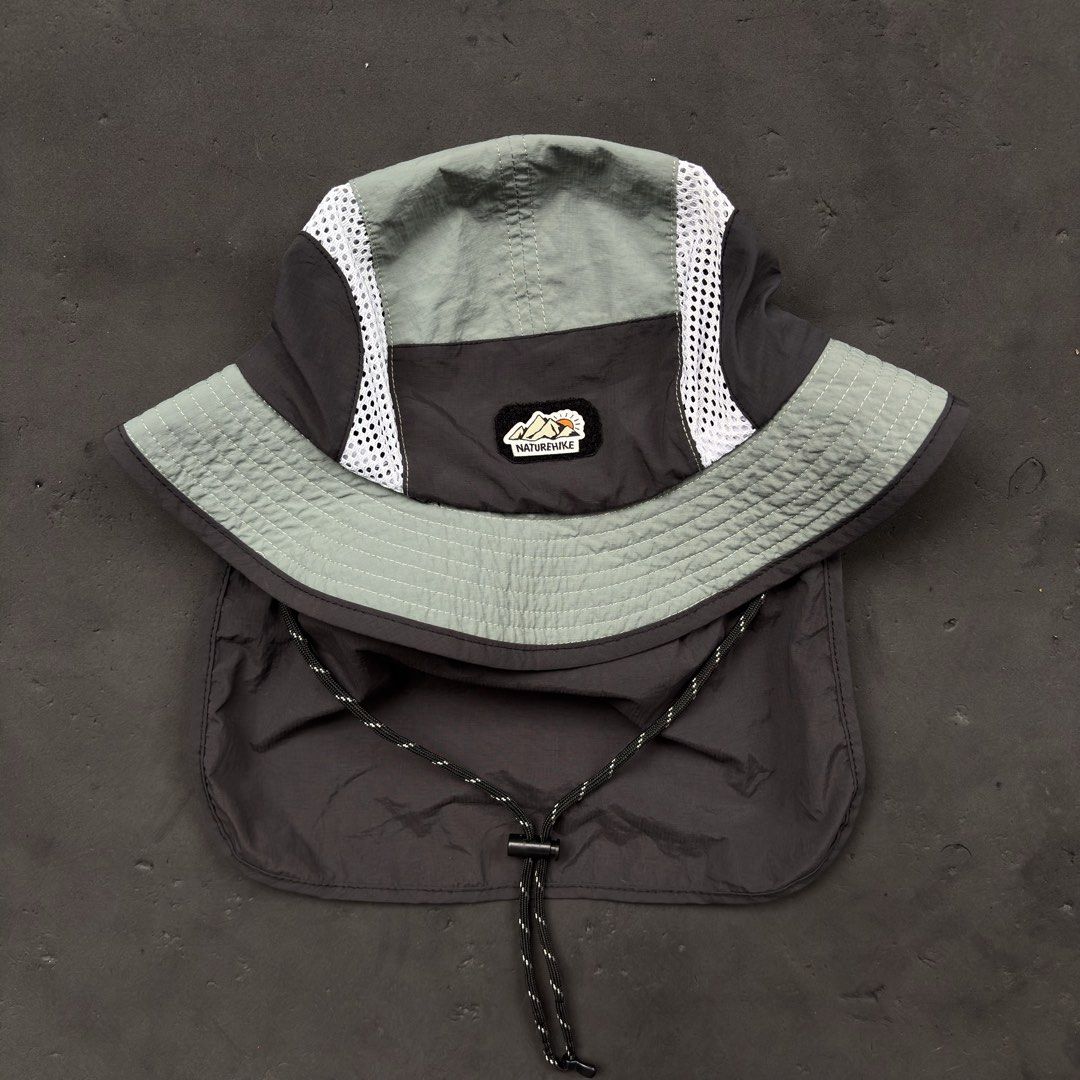 Nature Hike Sun Screen Mesh Bucket Hat (Category: Caps & Hats) located in Manila. Submitted by loydgani (Listing ID 1469856129, Image 1). Description: Key Features: • Condition: Good as new (9.5/10). No tears, stains, or signs of wear. Inner wash tag is completely crisp and clean. • Sun Protection: Features a wide 360° brim plus a long detachable snap-on neck flap at the back for maximum UV protection. • Breathable Design: Side mesh panels allow 