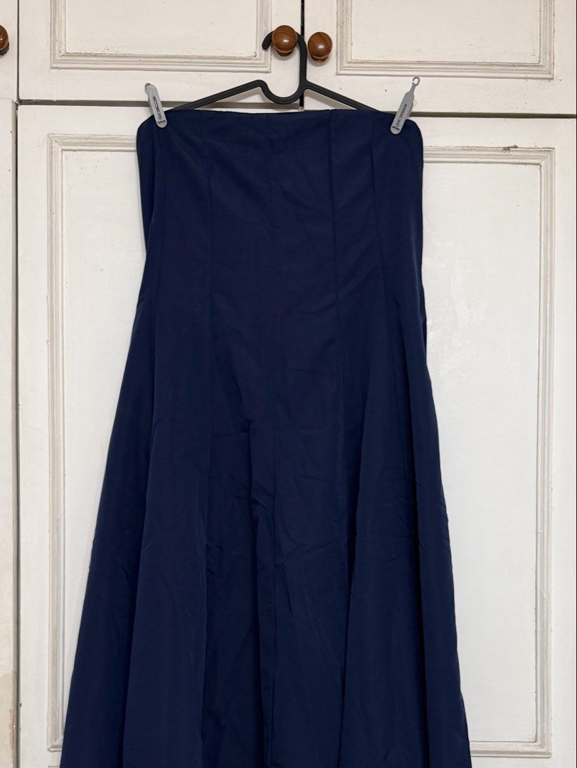 Navy Blue Maxi Skirt (Category: Skirts) located in Rizal. Submitted by rianaht (Listing ID 1469932405, Image 2). Description: - Color: Deep navy blue - Style: High-waisted, A-line maxi skirt with front panel seams - Length: Hits near the ankles - Fabric: Smooth material that drapes and hangs nicely - Versatility: Solid color that easily matches various tops - Occasion: Great for everyday casual outfits or smart-casual wear - Never been used 🌸 RF
