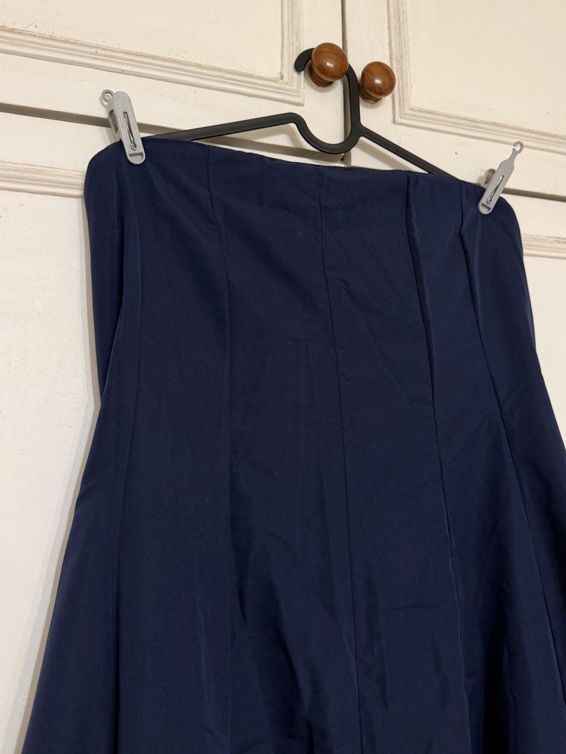 Navy Blue Maxi Skirt (Category: Skirts) located in Rizal. Submitted by rianaht (Listing ID 1469932405, Image 3). Description: - Color: Deep navy blue - Style: High-waisted, A-line maxi skirt with front panel seams - Length: Hits near the ankles - Fabric: Smooth material that drapes and hangs nicely - Versatility: Solid color that easily matches various tops - Occasion: Great for everyday casual outfits or smart-casual wear - Never been used 🌸 RF