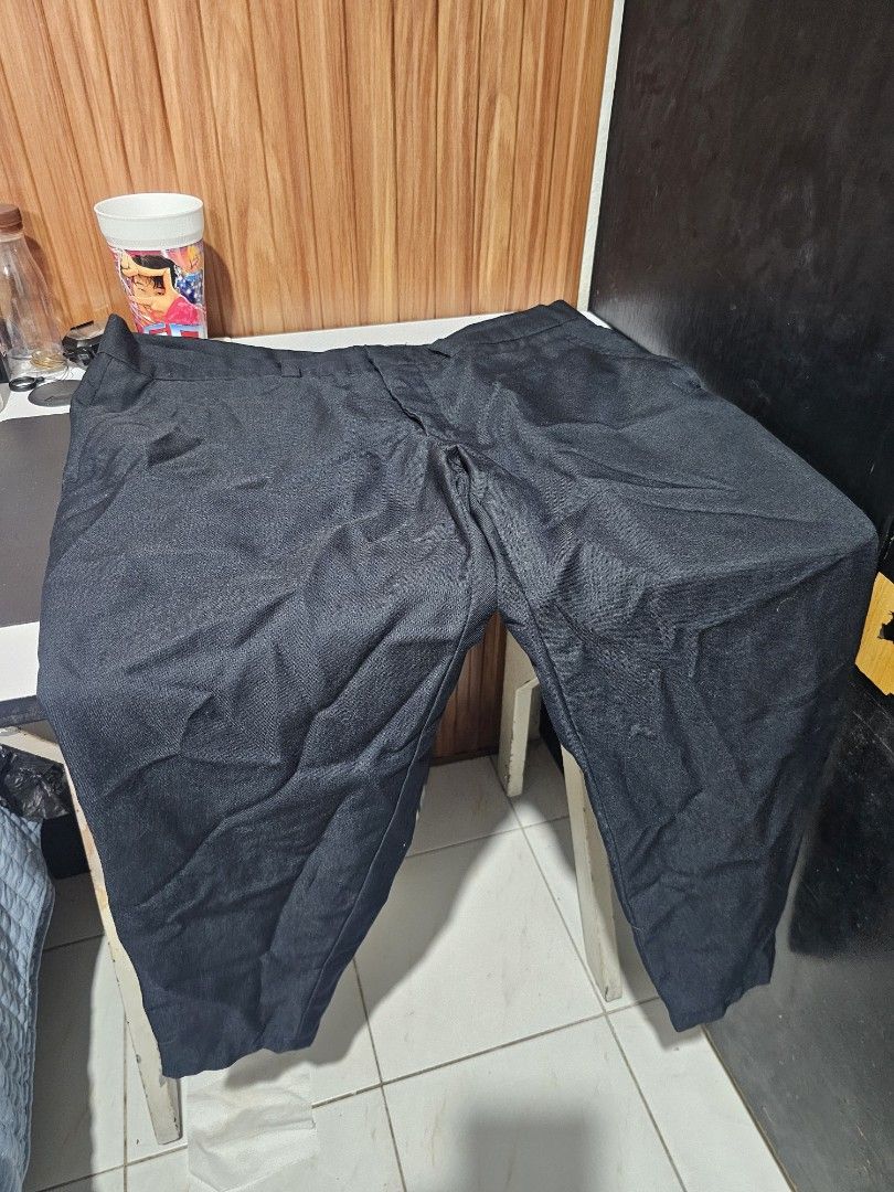 Navy Blue Slacks (Category: Trousers) located in Cainta. Submitted by ej_emuslan (Listing ID 1469784599, Image 1). Description: - Color: Solid black - Cut: Classic, ideal for work and smart-casual looks - Fabric: Textured material - Closure: Standard waistband with zipper and button - Versatility: Basic dark bottom that matches everything.