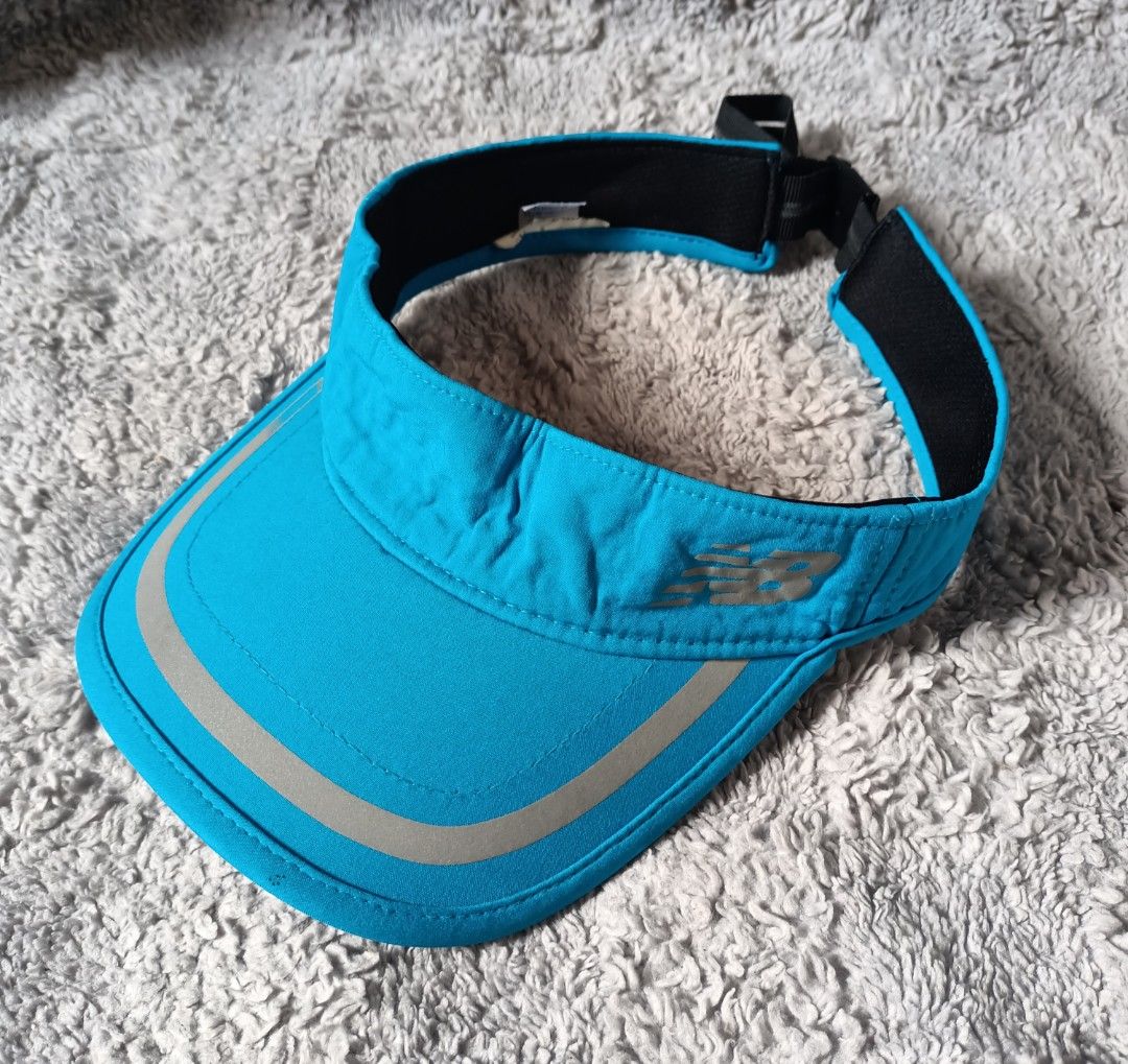 New balance visor cap (Category: Caps & Hats) located in Asingan. Submitted by arnelpalaris8 (Listing ID 1469846101, Image 2). Description: New balance Impact running visor OSFA VERYGOOD CONDITION • Model / Style: Impact Running Visor • Color: Blue / Light Blue • Material Composition: Typically 92% polyester and 8% spandex (or 100% polyester depending on the exact regional run) • Features: Moisture-wicking performance fabric, reflective piping an