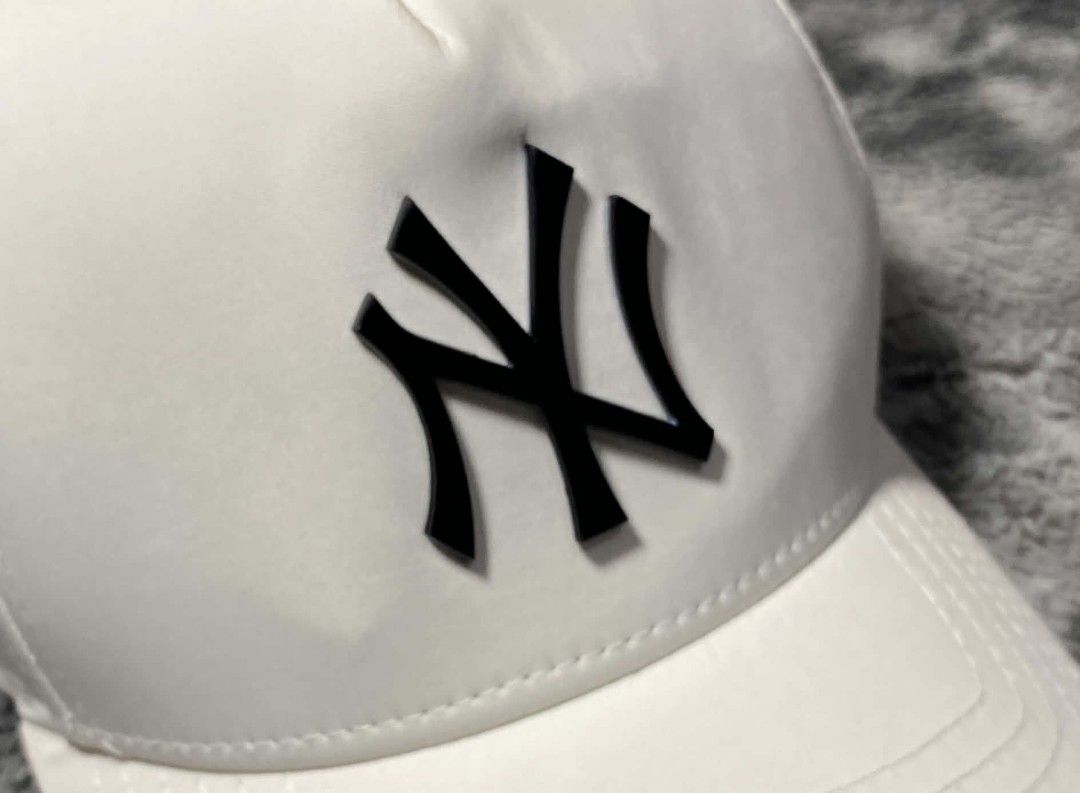New Era New York Yankees White Cap (Category: Caps & Hats) located in Sorsogon. Submitted by johnmichae69459 (Listing ID 1469865076, Image 2). Description: - Brand: New Era - Team: New York Yankees (Black raised logo) - Color: Clean White - Size: Medium/Large (M/L) - Material: 97% Polyester, 3% Spandex - Closure: Adjustable strap with metal buckle - Condition: Brand New.