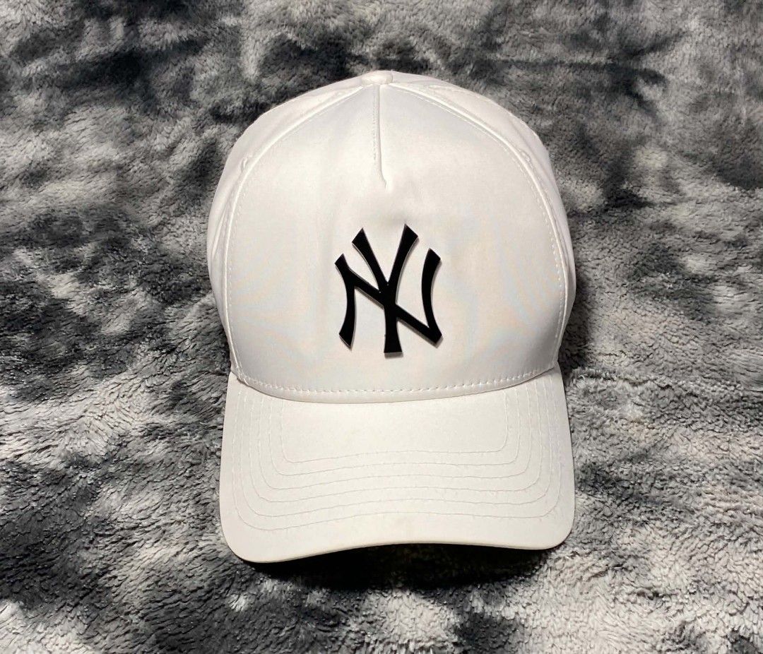 New Era New York Yankees White Cap (Category: Caps & Hats) located in Sorsogon. Submitted by johnmichae69459 (Listing ID 1469865076, Image 1). Description: - Brand: New Era - Team: New York Yankees (Black raised logo) - Color: Clean White - Size: Medium/Large (M/L) - Material: 97% Polyester, 3% Spandex - Closure: Adjustable strap with metal buckle - Condition: Brand New.