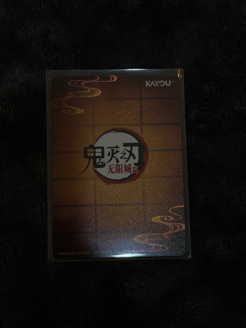 Nezuko Kamado GR (Category: Raw Singles) located in Cavite. Submitted by devareaux (Listing ID 1469866210, Image 2). Description: - Character: Nezuko Kamado (Demon Slayer / Kimetsu no Yaiba) - Brand: Kayou - Finish: Holographic with intricate borders and Japanese text - Condition: Near Mint / Pull-to-sleeve - Protection: Kept in a protective sleeve since pulling, clean surface, and sharp corners.