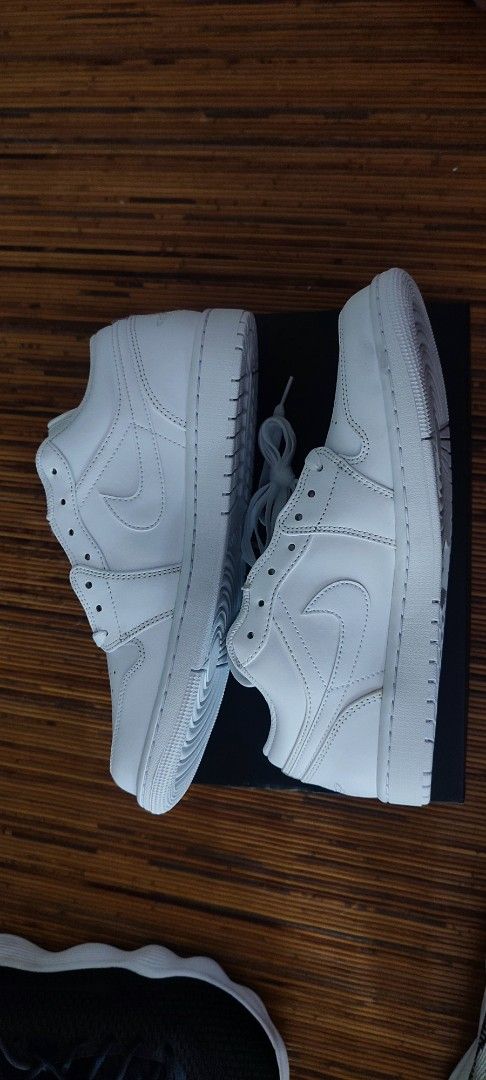 Nike Air Jordan 1 Low Triple White (Category: Sneakers) located in Manila. Submitted by jefftheplug (Listing ID 1469809065, Image 2). Description: BRAND NEW DEADSTOCK - 100% Authentic Nike Air Jordan 1 Low - Clean triple white colorway with premium leather upper - Perforated toe box for breathability and iconic style - Classic low-top silhouette featuring the Jumpman logo on the tongue - Versatile everyday rotation pair that matches any outfit - 