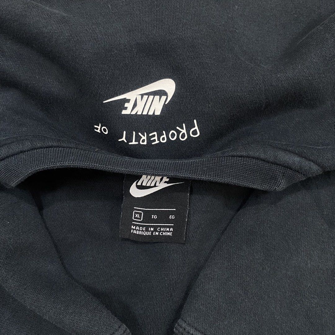 Nike Black Graphic Print Sweatshirt Size XL (Category: Coats, Jackets and Outerwear) located in Cagayan de Oro. Submitted by sepamorash53558 (Listing ID 1469796837, Image 3). Description: - Brand: Nike - Color: Black with large white chest graphic - Size: XL (Measures 21" x 24" inches) - Material: Comfortable cotton and polyester fleece blend - Details: Features trademark text and 'Property of' inside collar branding - Condition: Excellent pre-ow
