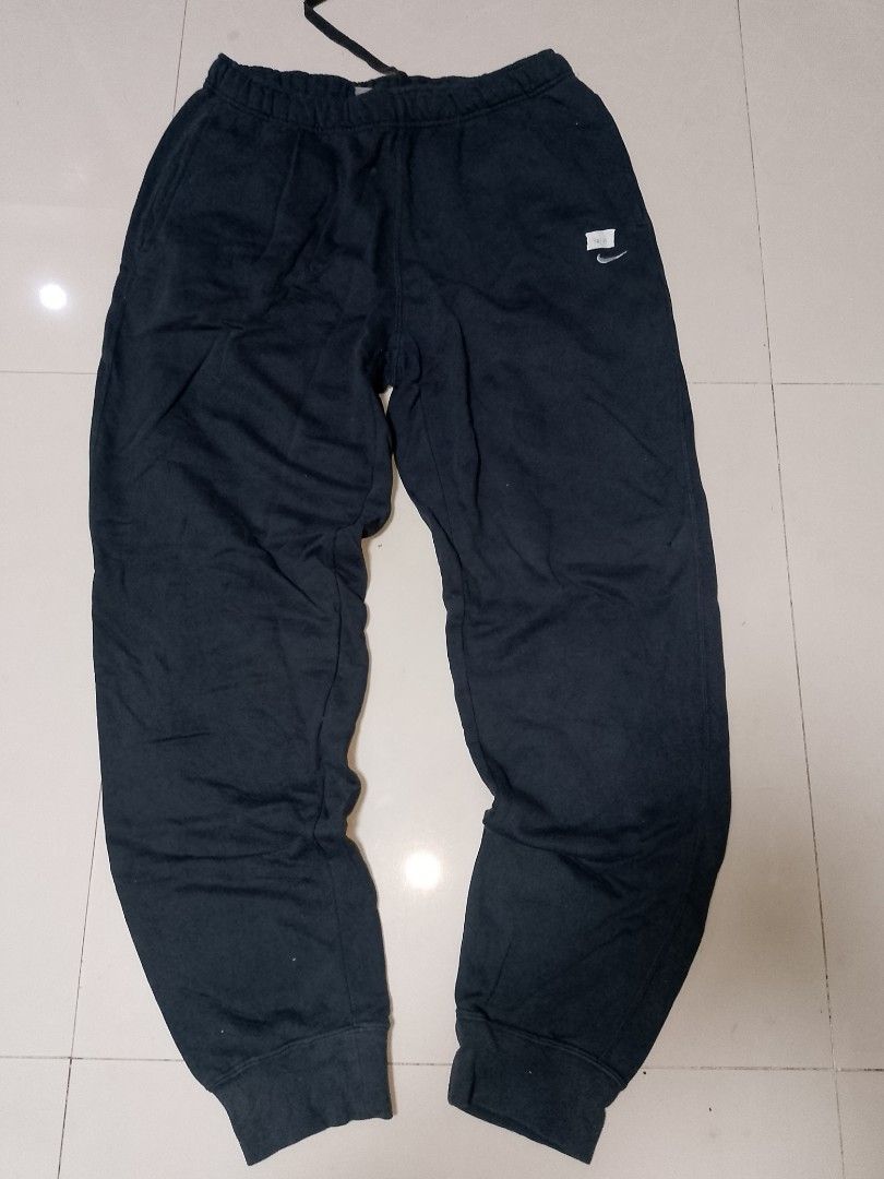 Nike Black Sweatpants (Category: Joggers) located in Manila. Submitted by mjthrifted_second (Listing ID 1469832503, Image 1). Description: Code 8 - Brand: Nike - Color: Black - Size: XL - Waist: Elastic waistband with adjustable drawstring - Cuffs: Ribbed ankle cuffs for a secure fit - Pockets: Single back pocket on the right side - Branding: Small embroidered logo on the left thigh - Condition: Normal wear, comfortable fit - Ideal for: Lounging 