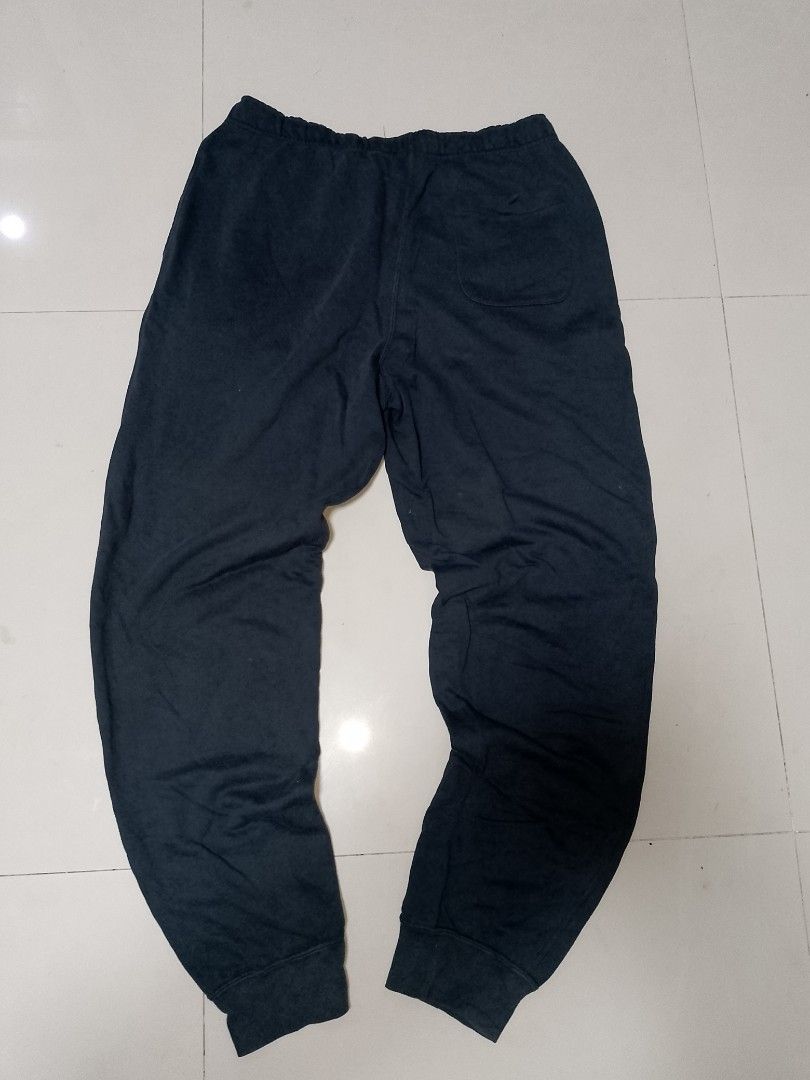 Nike Black Sweatpants (Category: Joggers) located in Manila. Submitted by mjthrifted_second (Listing ID 1469832503, Image 2). Description: Code 8 - Brand: Nike - Color: Black - Size: XL - Waist: Elastic waistband with adjustable drawstring - Cuffs: Ribbed ankle cuffs for a secure fit - Pockets: Single back pocket on the right side - Branding: Small embroidered logo on the left thigh - Condition: Normal wear, comfortable fit - Ideal for: Lounging 