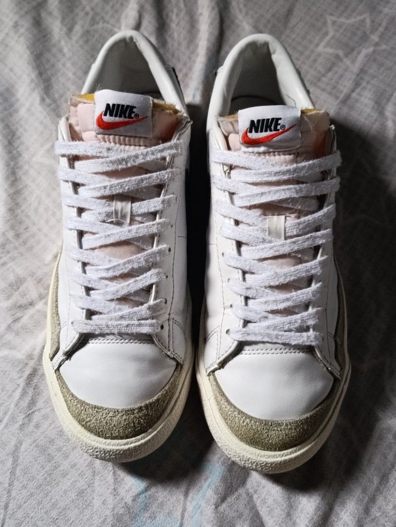 Nike Blazer Low '77 Vintage White Black (Category: Sneakers) located in Manila. Submitted by keenforest.c4b4c0 (Listing ID 1469867054, Image 2). Description: White leather low-top sneakers from Nike. Black swoosh on the sides with suede overlays at the toe and forefoot. Exposed foam tongue design with retro Nike branding on the tongue tag and heel tab. Textured rubber sole with herringbone tread pattern. Clean white laces included..