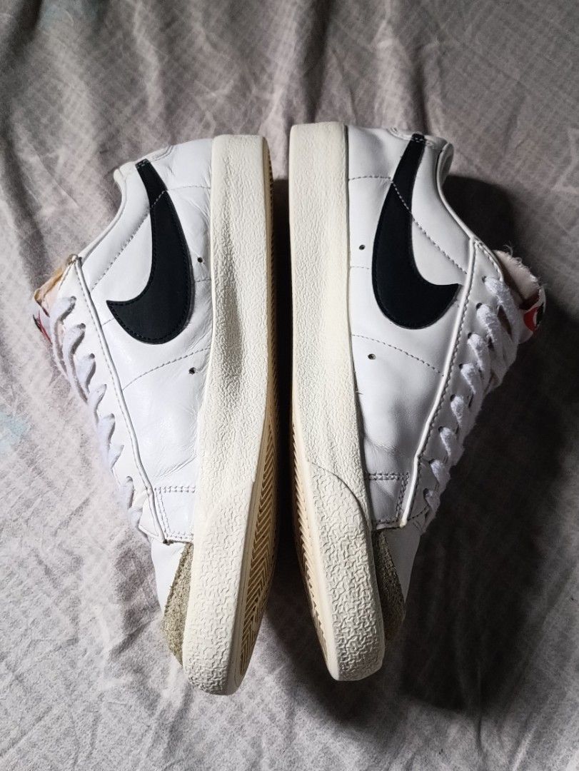 Nike Blazer Low '77 Vintage White Black (Category: Sneakers) located in Manila. Submitted by keenforest.c4b4c0 (Listing ID 1469867054, Image 3). Description: White leather low-top sneakers from Nike. Black swoosh on the sides with suede overlays at the toe and forefoot. Exposed foam tongue design with retro Nike branding on the tongue tag and heel tab. Textured rubber sole with herringbone tread pattern. Clean white laces included..