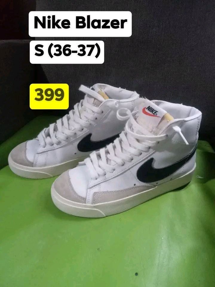 Nike Blazer White Black Mid Top Sneakers (Category: Sneakers) located in Caloocan City. Submitted by casio21 (Listing ID 1469766004, Image 1). Description: - White leather high-top sneakers - Features iconic black swoosh logos - Stylish grey suede toe overlays - Complete with white laces and padded collars - Classic basketball heritage silhouette - Tagged size: 36-37.