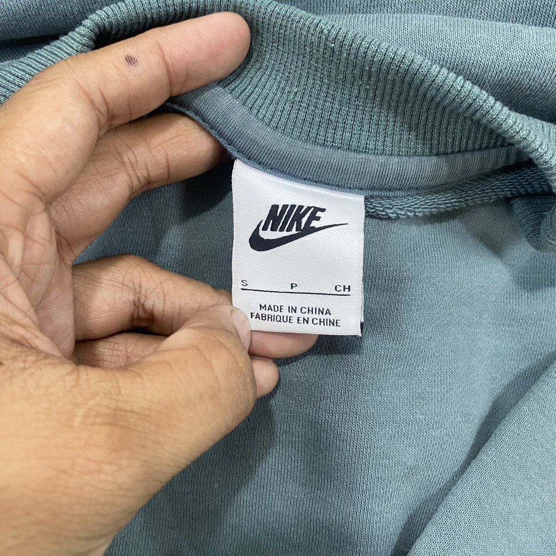 Nike Blue Multi Swoosh Sweatshirt Size S (Category: Coats, Jackets and Outerwear) located in Cagayan de Oro. Submitted by sepamorash53558 (Listing ID 1469797722, Image 3). Description: - Brand: Nike - Item: Blue crewneck sweatshirt with embroidered multi swoosh logo - Size: S (Pit-to-pit: 21 inches, Length: 27 inches) - Material: 88% cotton, 12% polyester - Details: Ribbed collar, cuffs, and hem - Origin: Made in China - Condition: Clean piece, c