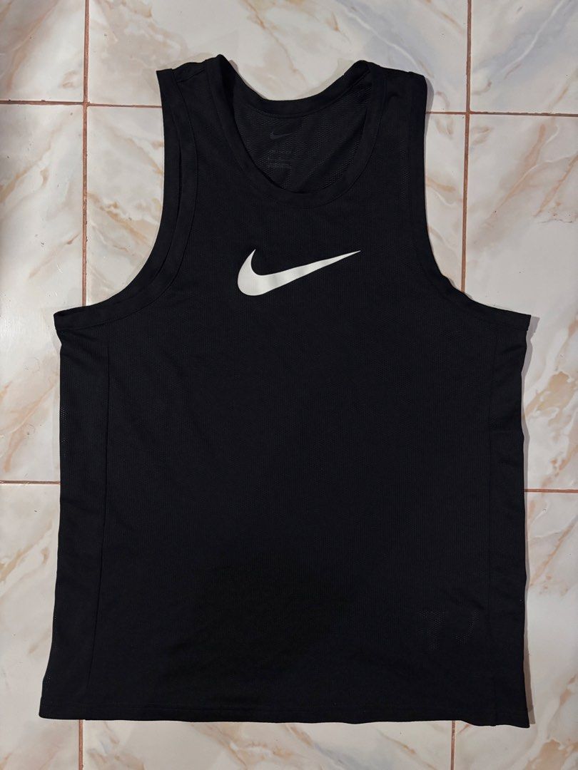 Nike Dri-FIT Black Training Tank Top Size L (Category: Activewear) located in Dumaguete. Submitted by revillahar03975 (Listing ID 1469778902, Image 1). Description: - Brand: Nike - Item: Black training tank top - Size: L - Material: Breathable Dri-FIT mesh fabric for cooling - Design: Large white Swoosh graphic on the chest - Style Code: BV9388-010 - Condition: Clean, no stains, no holes.