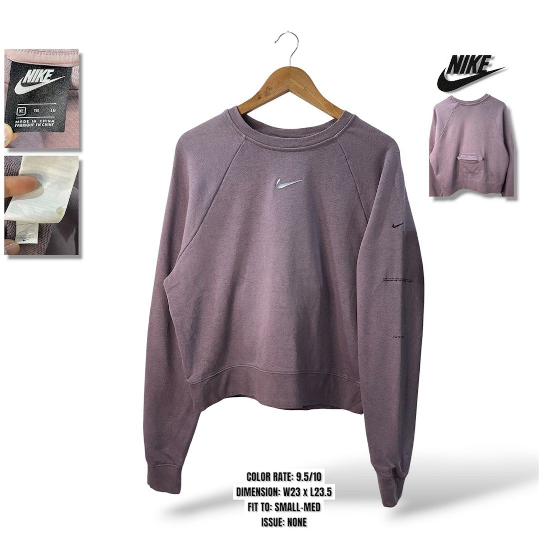 Nike Dusty Purple Cropped Sweatshirt (Category: Coats, Jackets and Outerwear) located in Cabagan. Submitted by blessingma81004 (Listing ID 1469766435, Image 1). Description: - Brand: Nike - Style: Crewneck sweatshirt with a trendy cropped fit and long sleeves - Size: XL - Color: Dusty purple - Details: Small silver embroidered Swoosh on chest, unique text graphics on the left sleeve, and a handy small pocket on the back near the hem - Origin: Mad