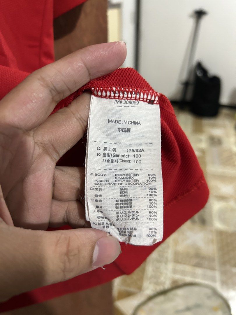Nike Golf Sphere React Red Polo Shirt Size L (Category: Tshirts & Polo Shirts ) located in Davao. Submitted by orbetaarch23339 (Listing ID 1469920228, Image 3). Description: - Brand: Nike Golf - Style: Half-zip polo shirt with contrast shoulder insets - Color: Red - Size: L - 22x28 - Material: 90% polyester, 10% spandex - Special Feature: Nike Sphere React technology tag - Condition: Clean and ready to wear for golf or casual outings.